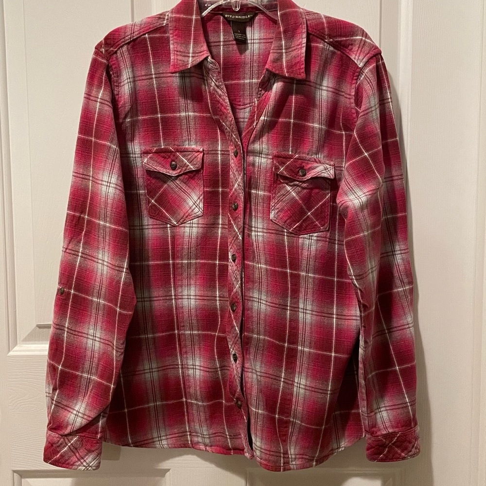 Bit and bridle women’s pink plaid flannel shirt.